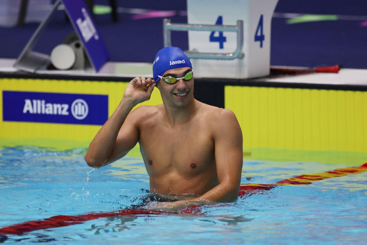 A male swimmer on a lane in the pool
