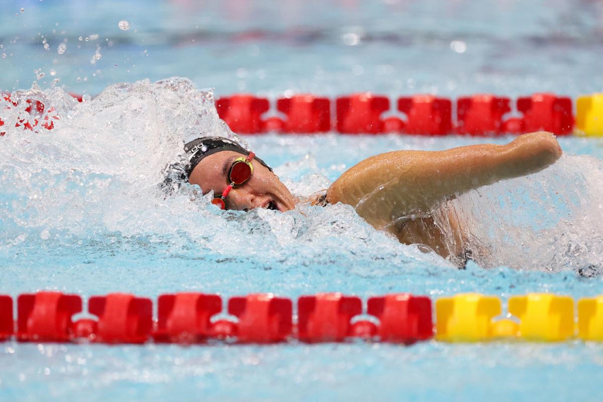 A female swimmer in a competition