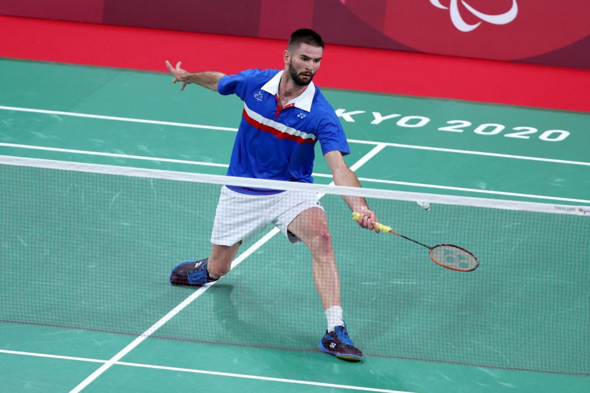 A male Para badminton player competes
