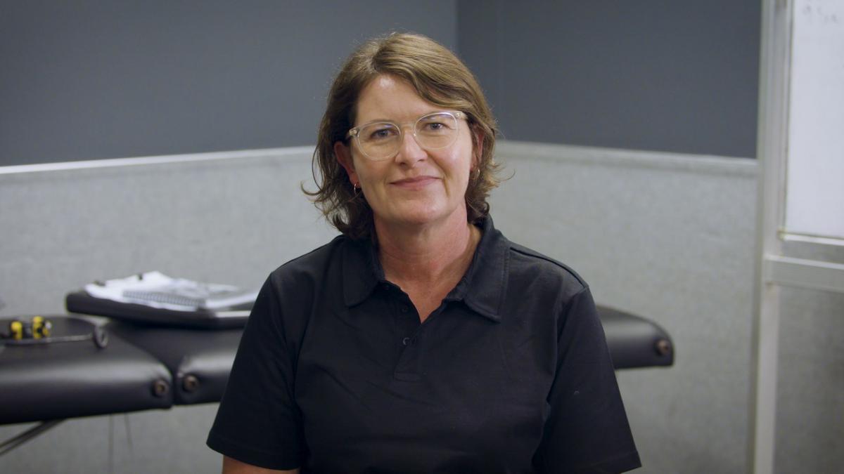 A woman smiling in an office