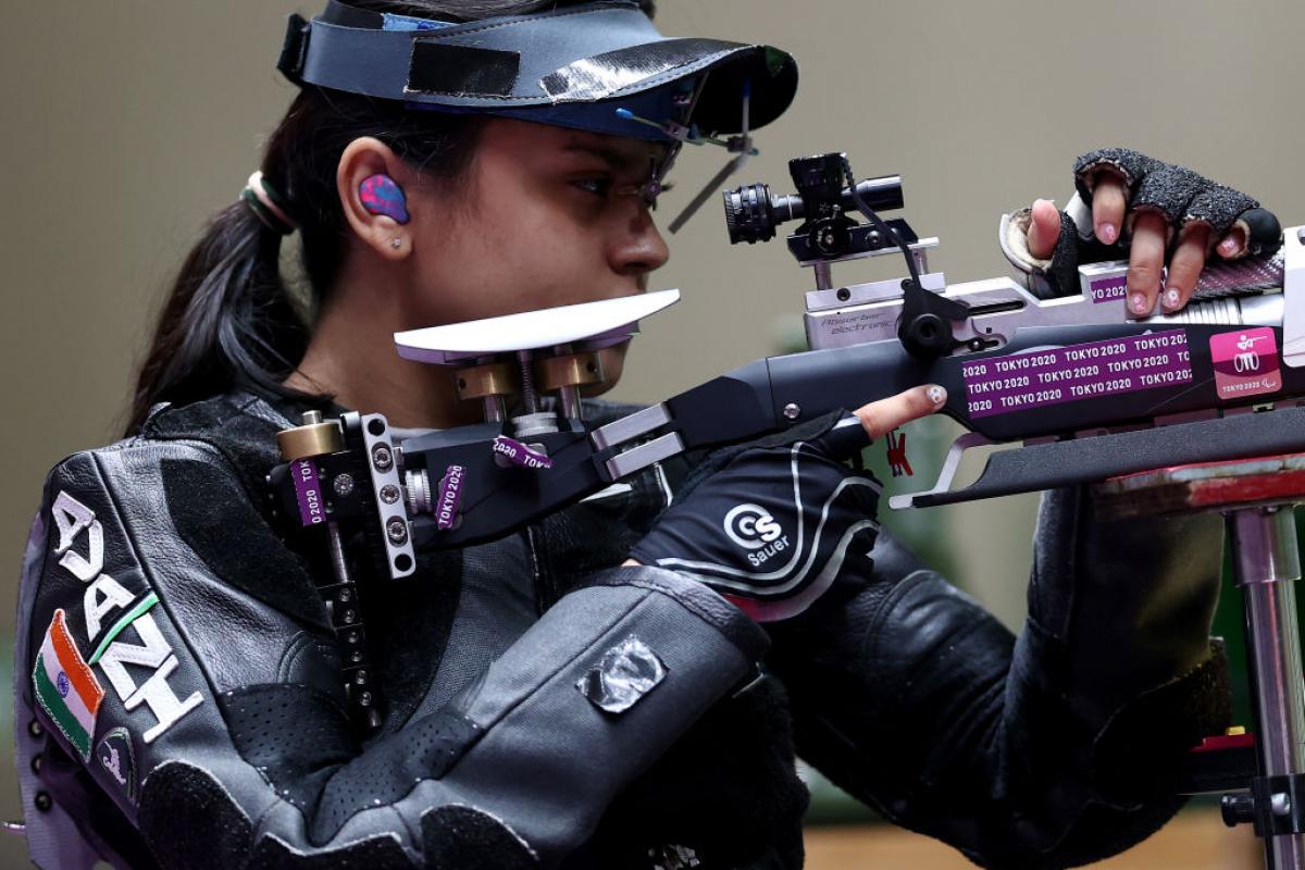 A female rifle shooter in a competition