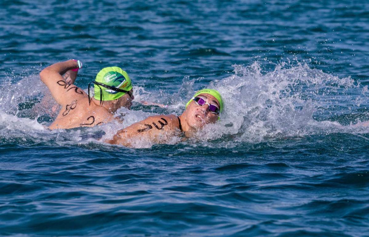 Two male swimmers in an open water competiion