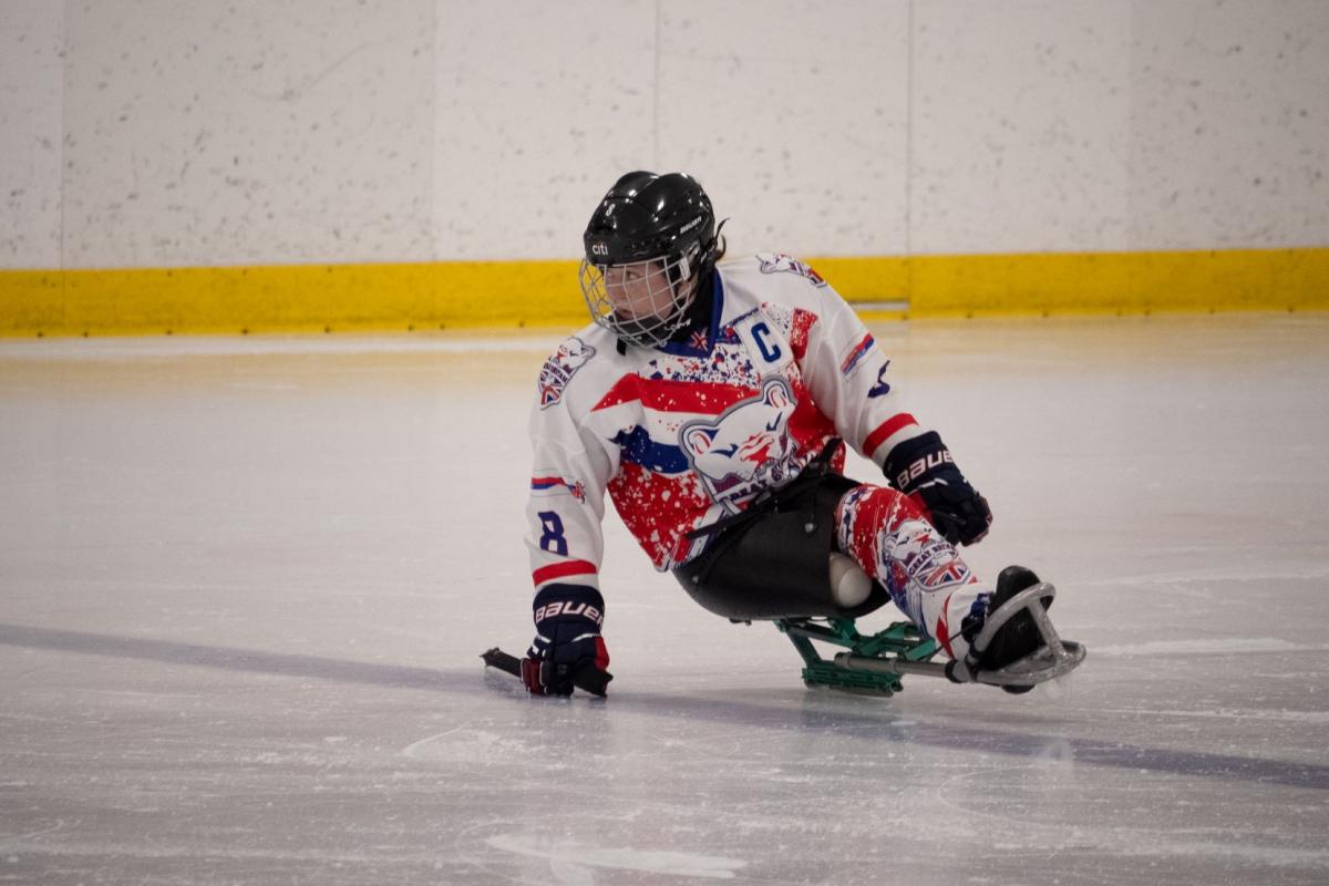 A female Para ice hockey player on ice