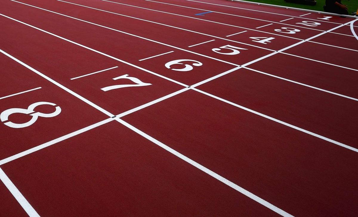 The finish line of a red athletics track