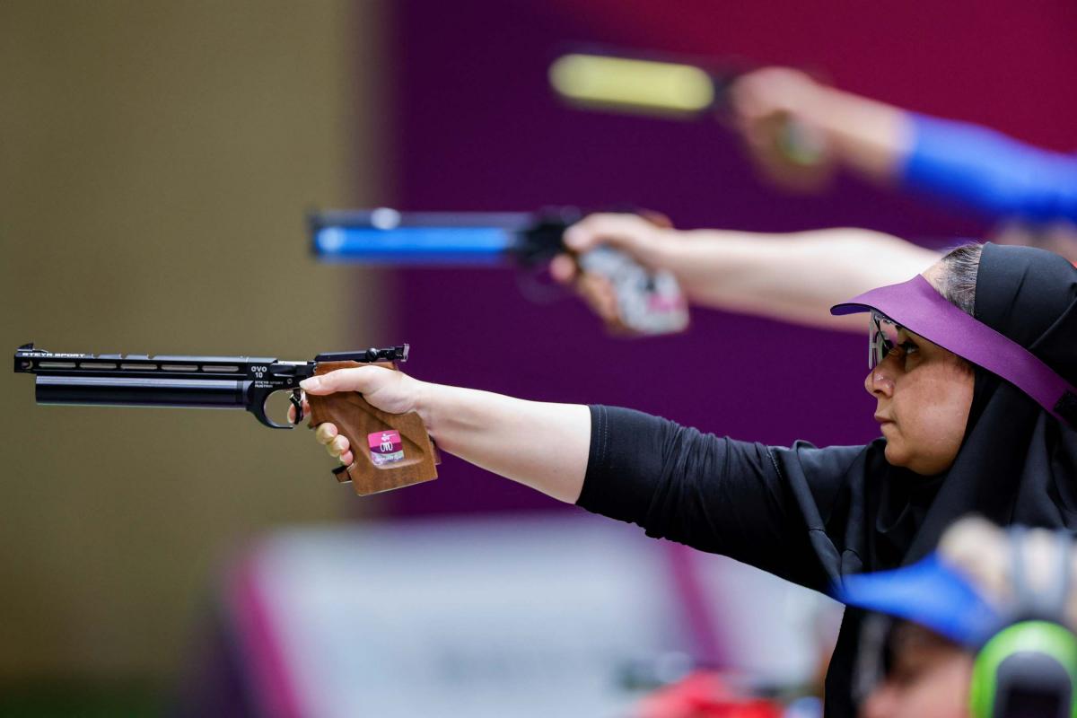 A female shooter in a pistol competition