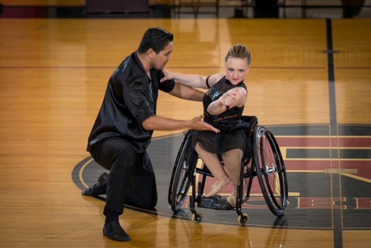 A female wheelchair dancer with a standing male partner