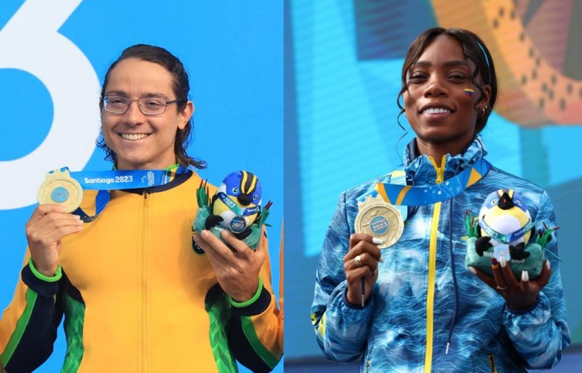 A man and a woman on the podium showing their gold medals