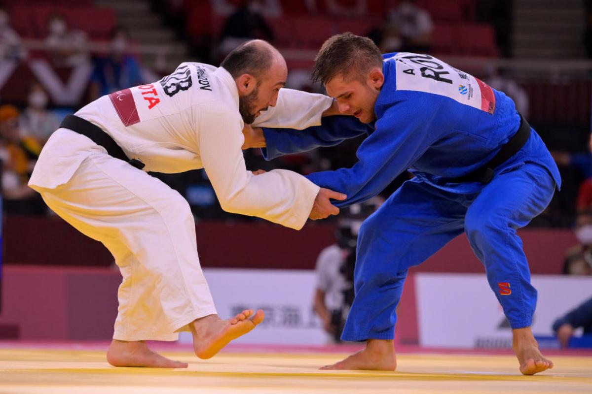Two males judokas in action at Tokyo 2020. 