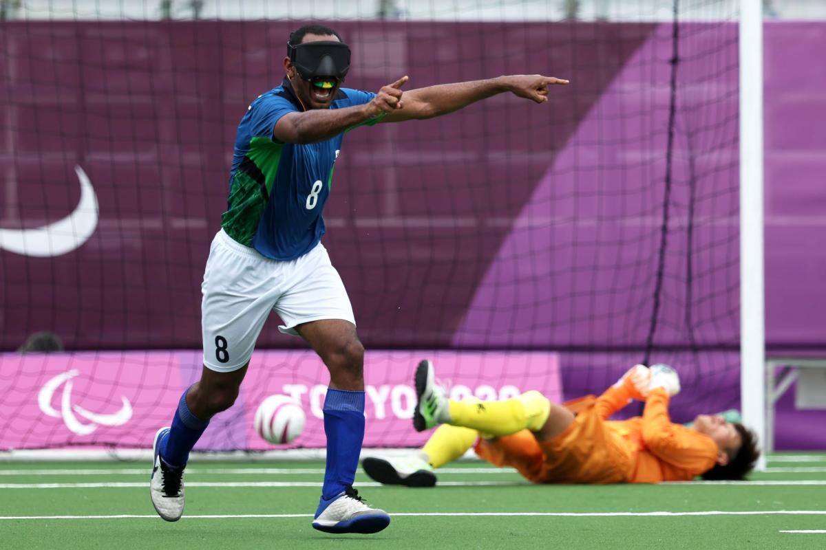 Raimundo 'Nonato' Mendes, a male blind football player from Brazil, celebrates after scoring a goal at the Tokyo 2020 Paralympics.