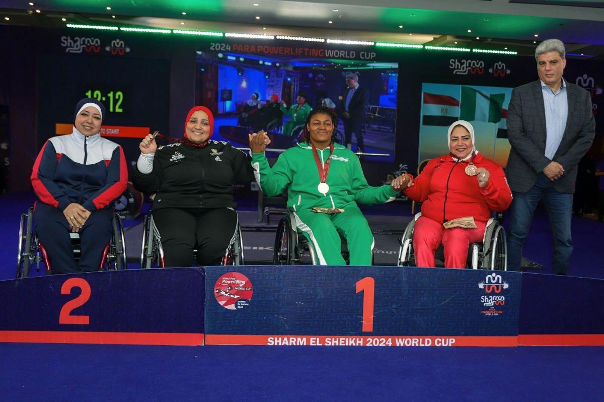 Athletes strike a pose on the podium
