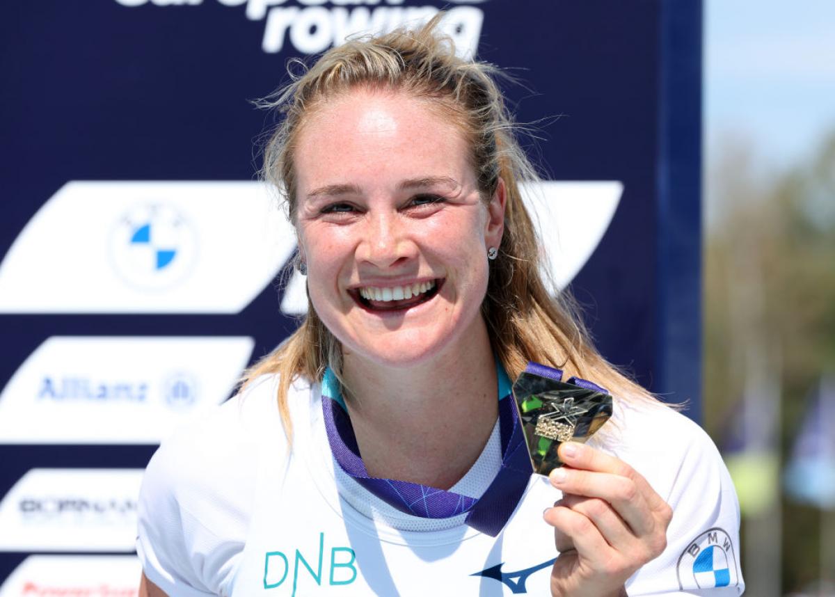 Para rower Birgit Skarstein smiling and holding a gold medal 