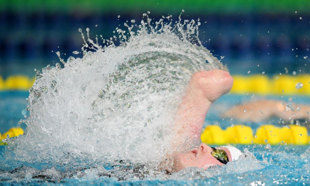 An armless female swimmer in a competition
