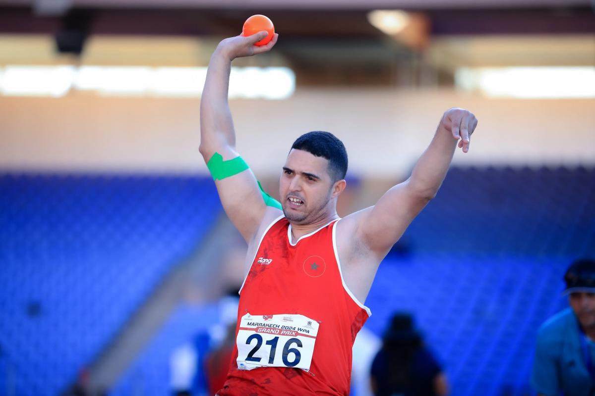 A shot putter in action