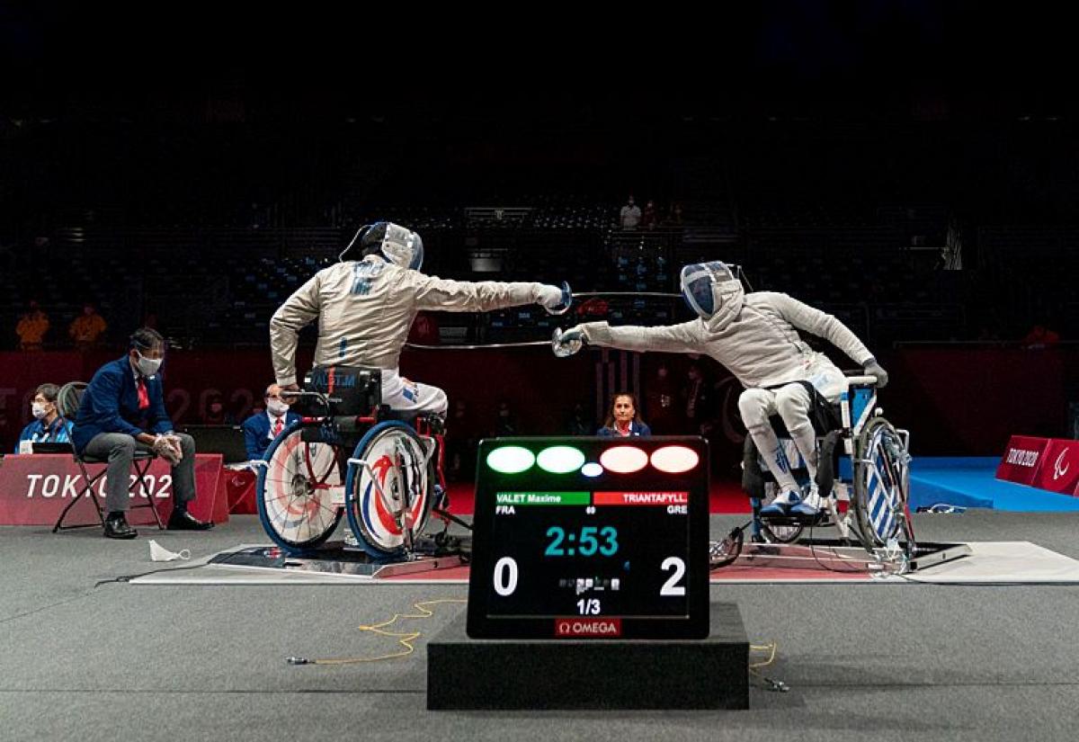 Two wheelchair fencers in action at the Tokyo 2020 Paralympic Games