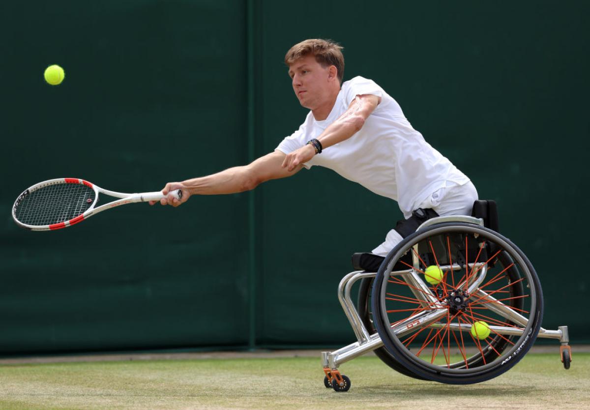 A male wheelchair tennis player in action