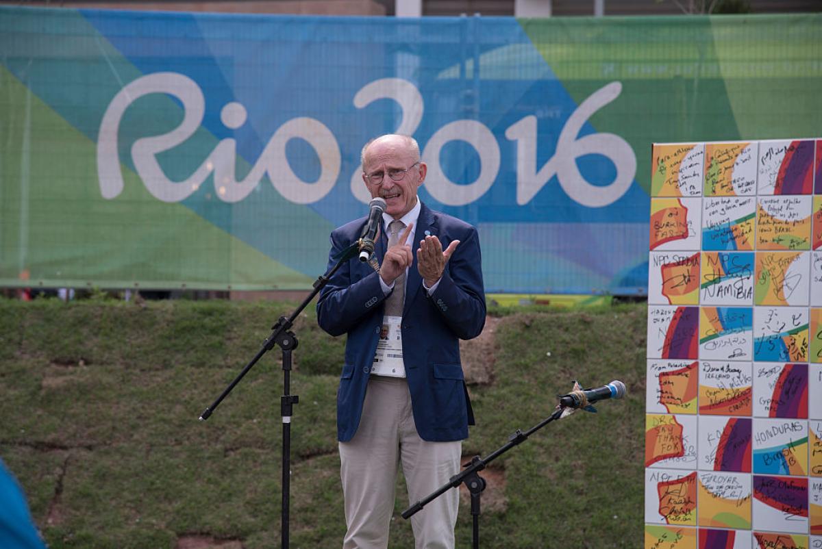 Wilfried Lemke, speaks at the Paralympic Mural Ceremony held at the Rio 2016 Paralympics. He is making a speech in front of a banner that reads Rio 2016.