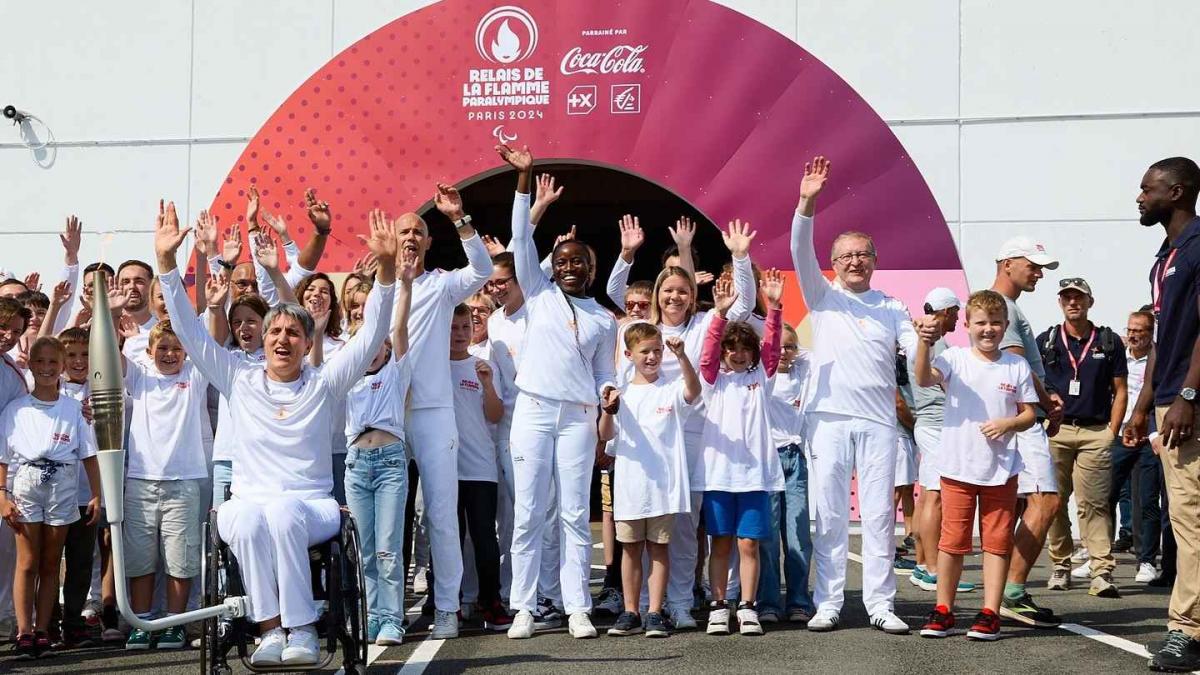 a group of Para athletes cheering outside the Channel Tunnel 