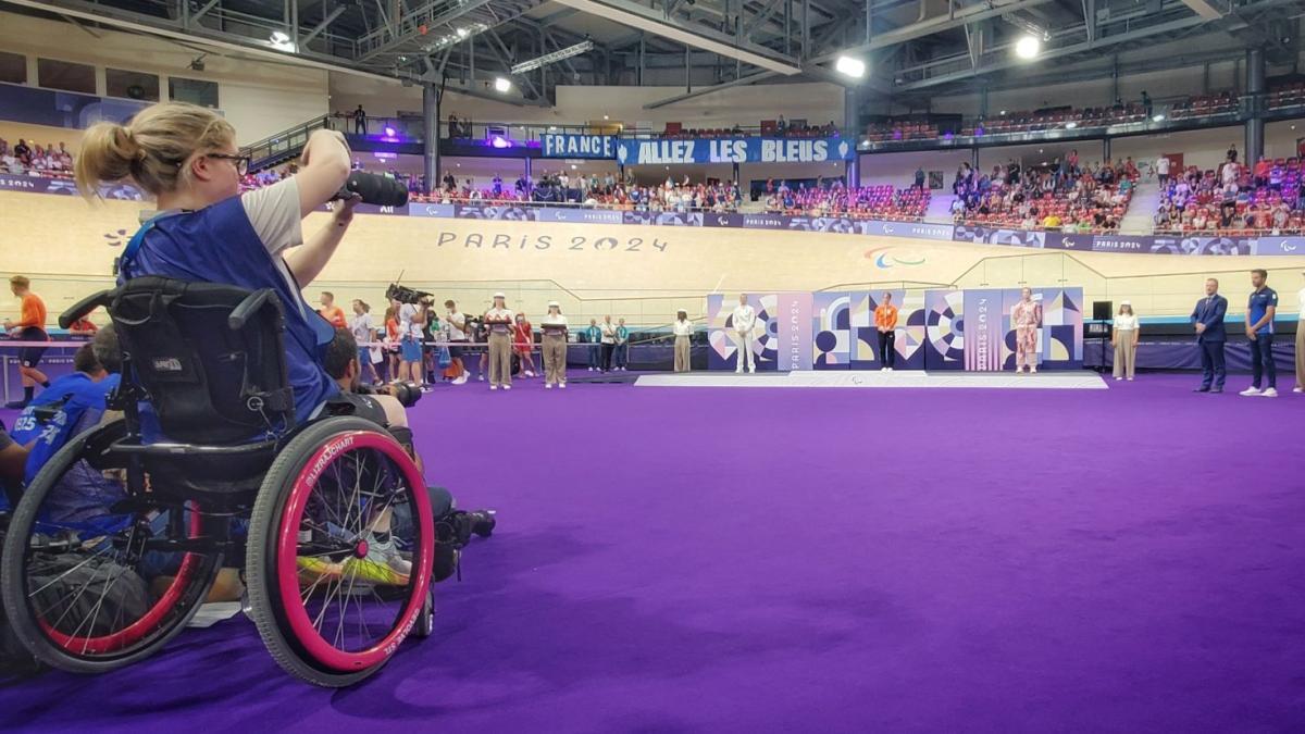 Woman in wheelchair takes photo