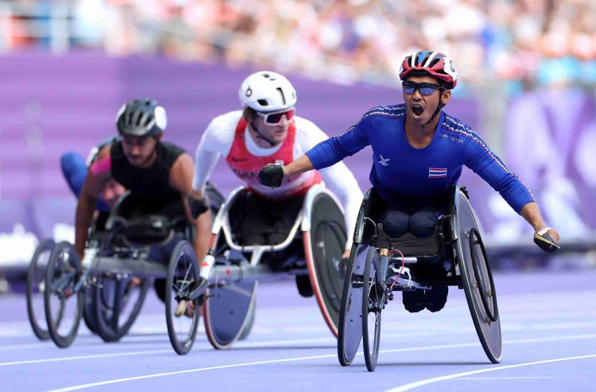 An athlete celebrate after winning the race