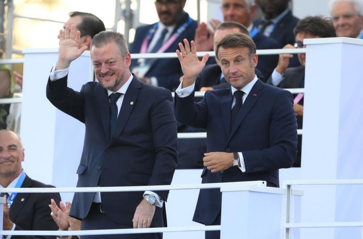 Andrew Parsons and Emmanuel Macron wave to the crowd