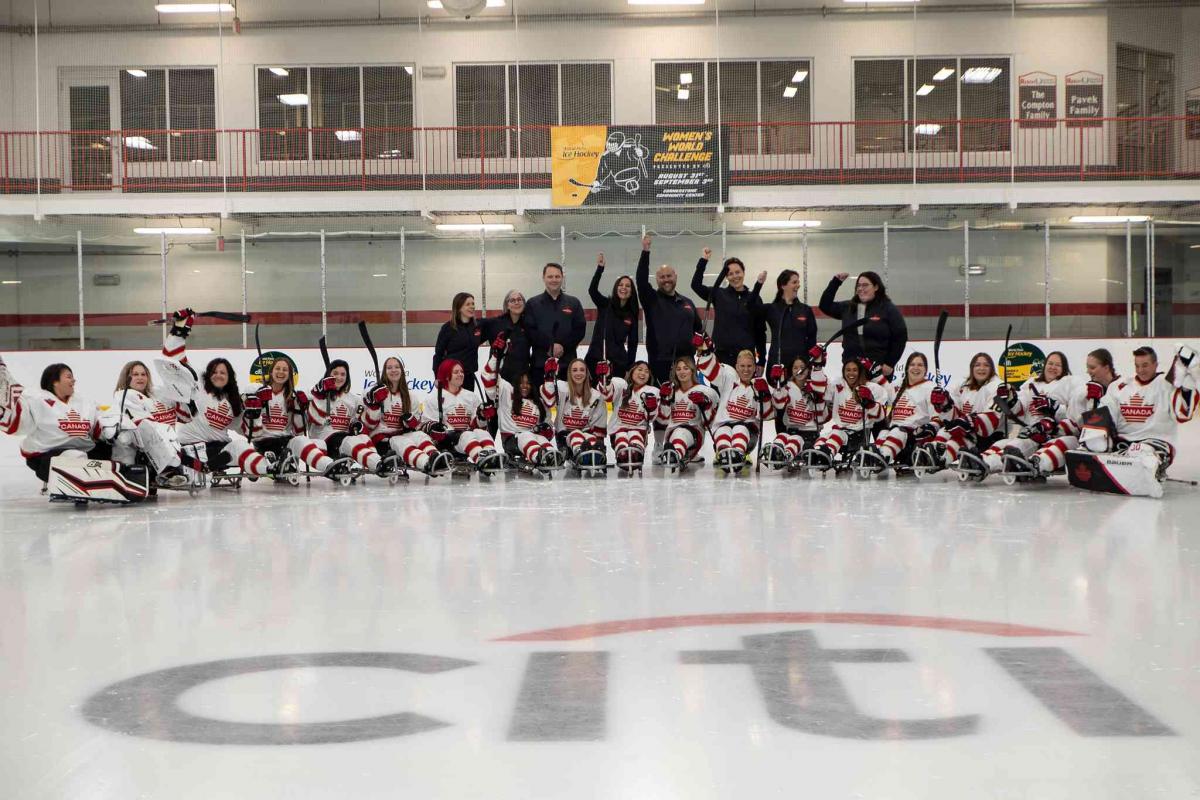 Players pose for a group picture after a match