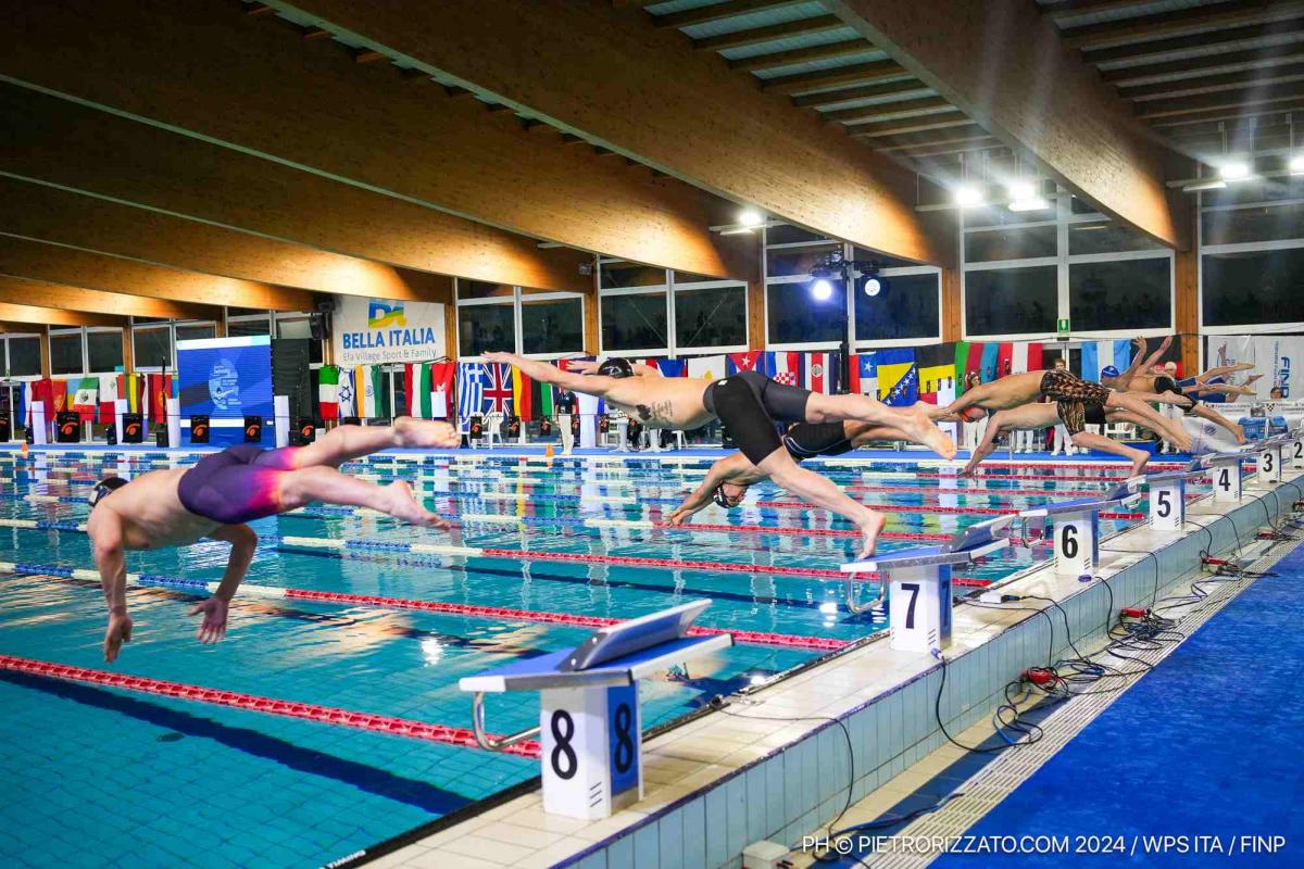 Swimmers jump into the pool to start their campaigns