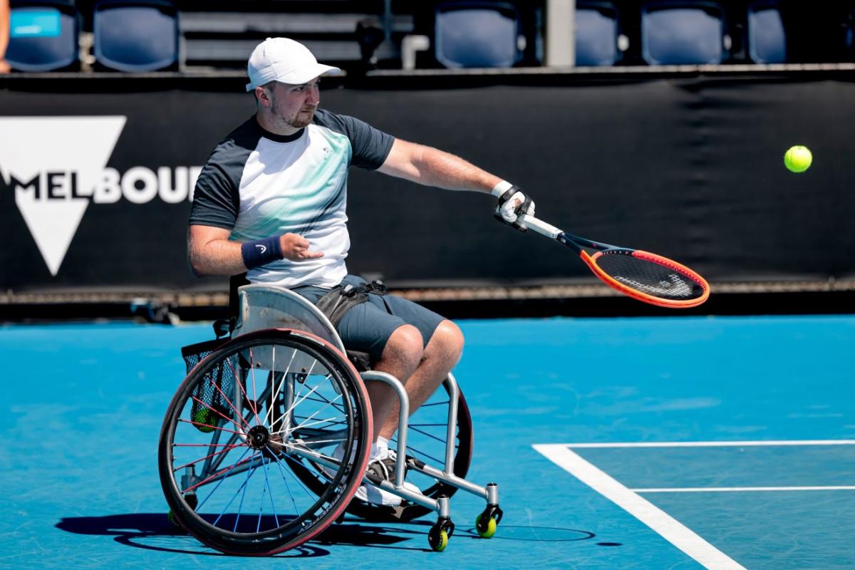 A male wheelchair tennis player in action