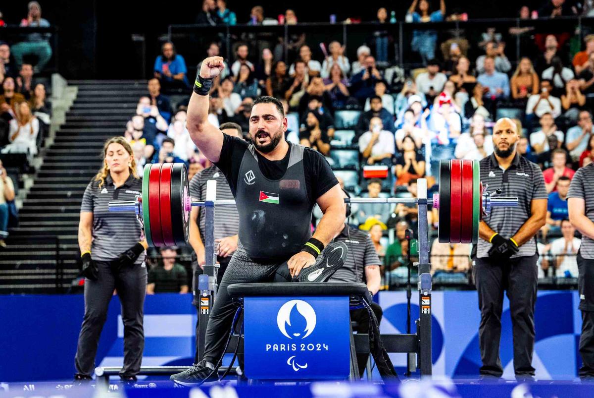 An athlete reacts after his lift