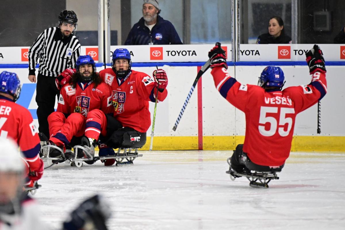 Four Czech Para ice hockey players celebrating on ice