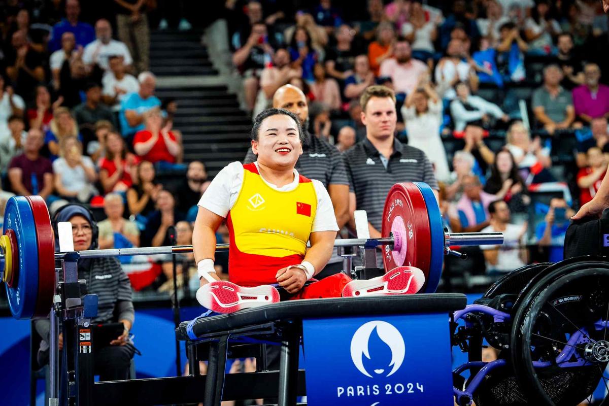 An athlete gestures after a lift