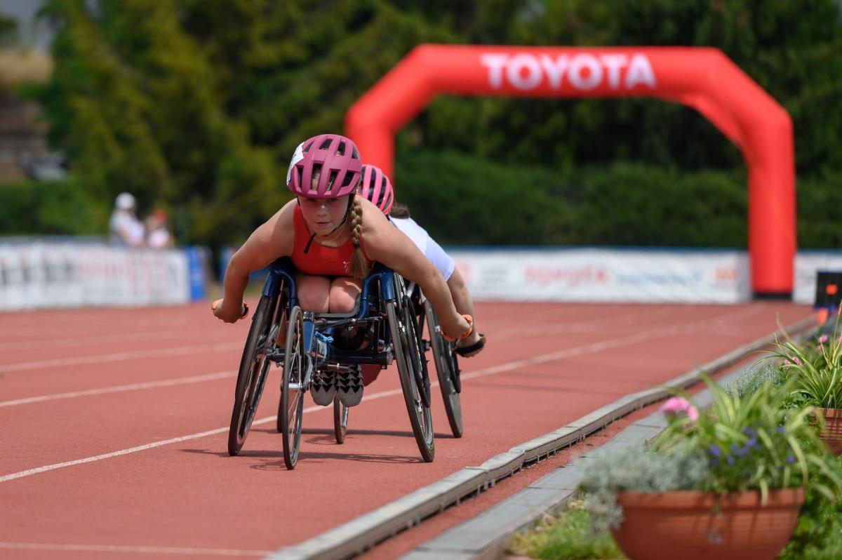A wheelchair racing athlete in action