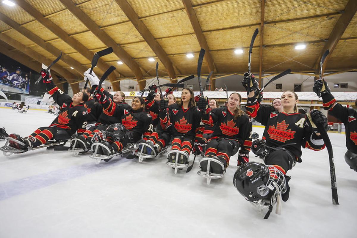 The Canadian women's Para ice hockey team waving to the crowd