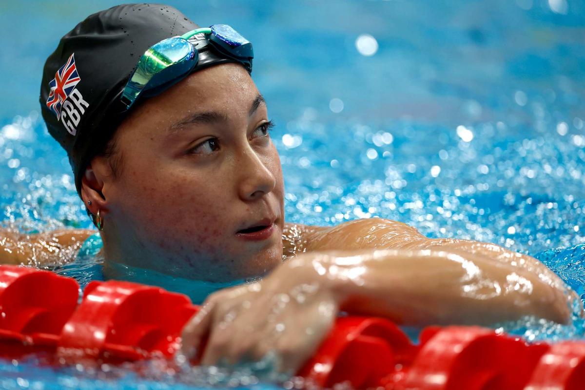 A swimmer gestures after a race
