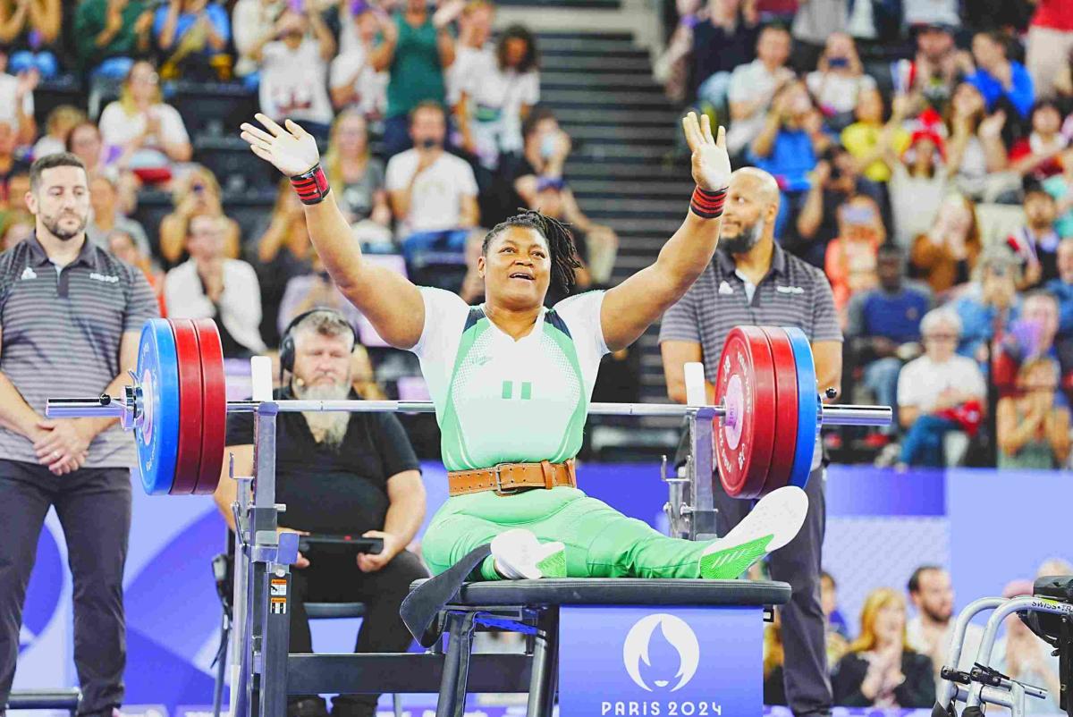 An athlete reacts after a successful lift