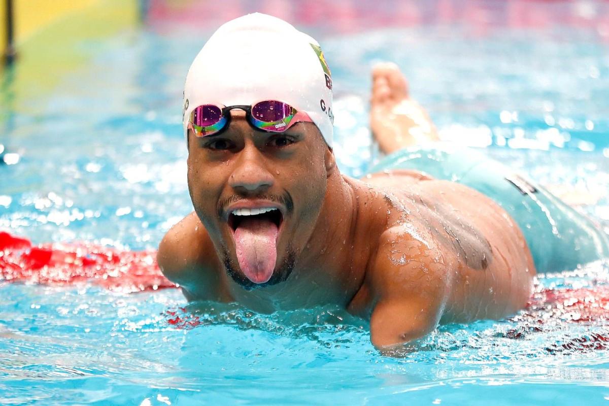 A swimmer gestures after a race