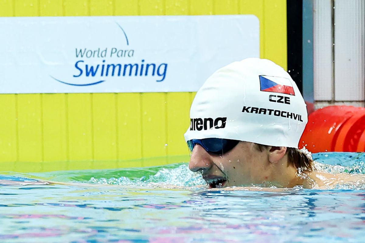 A male blind swimmer in the pool