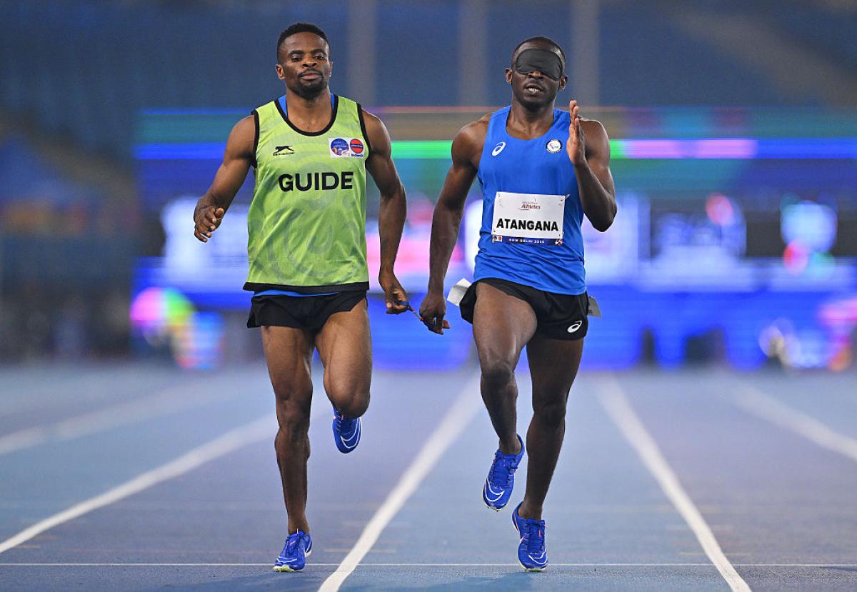 An athlete and guide in action