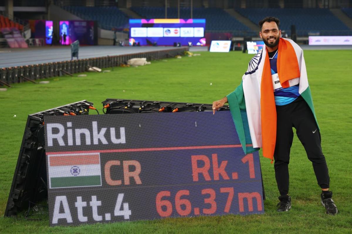 A player celebrates his throw that earned him Championship record. 