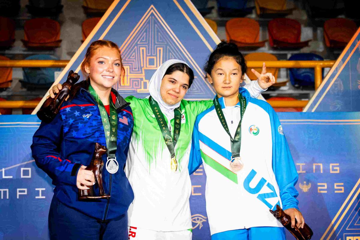 Athletes smile on podium
