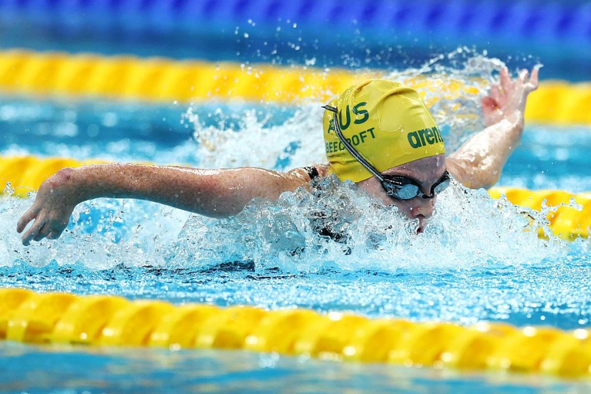 A female Para swimmer competing in a butterfly event