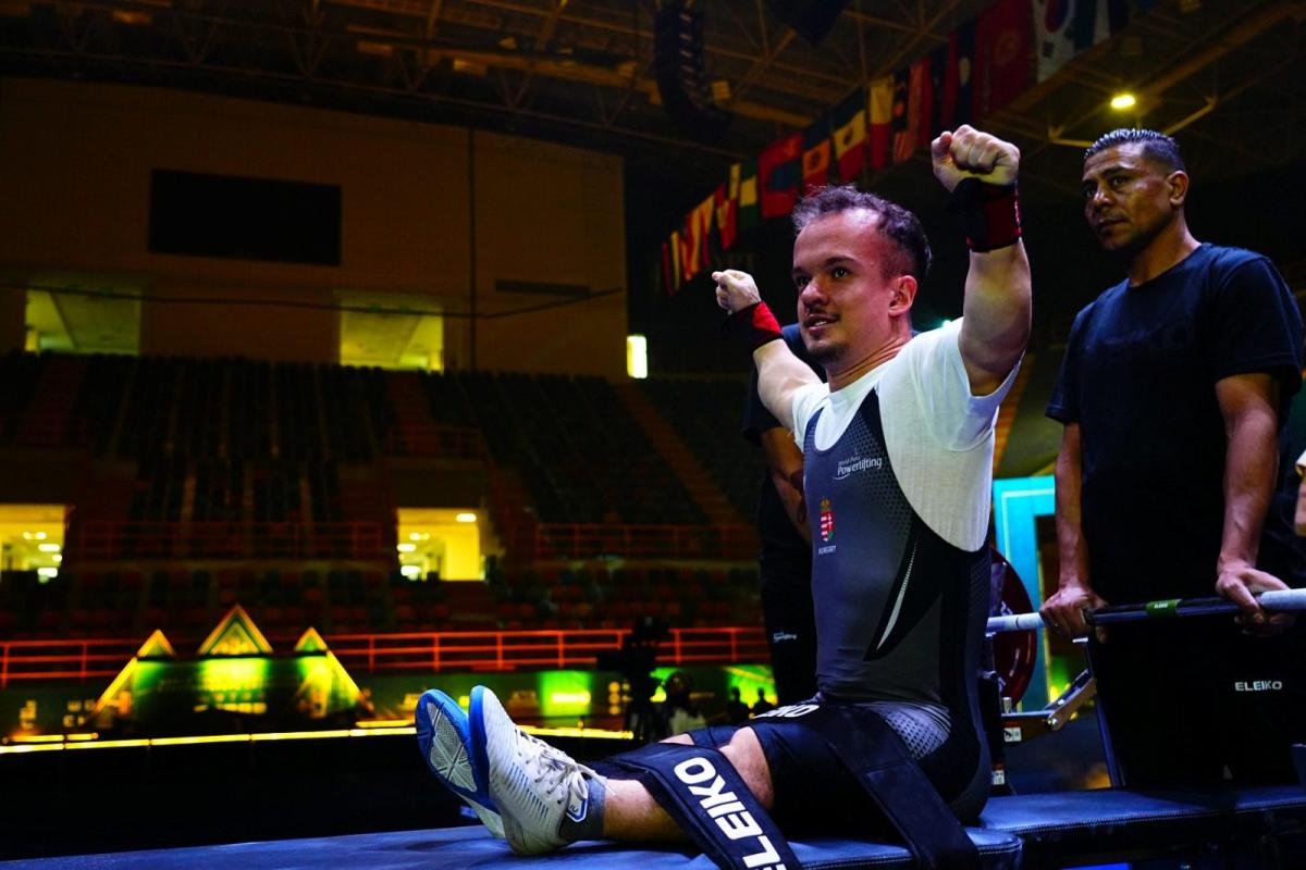 An athlete reacts after a successful lift