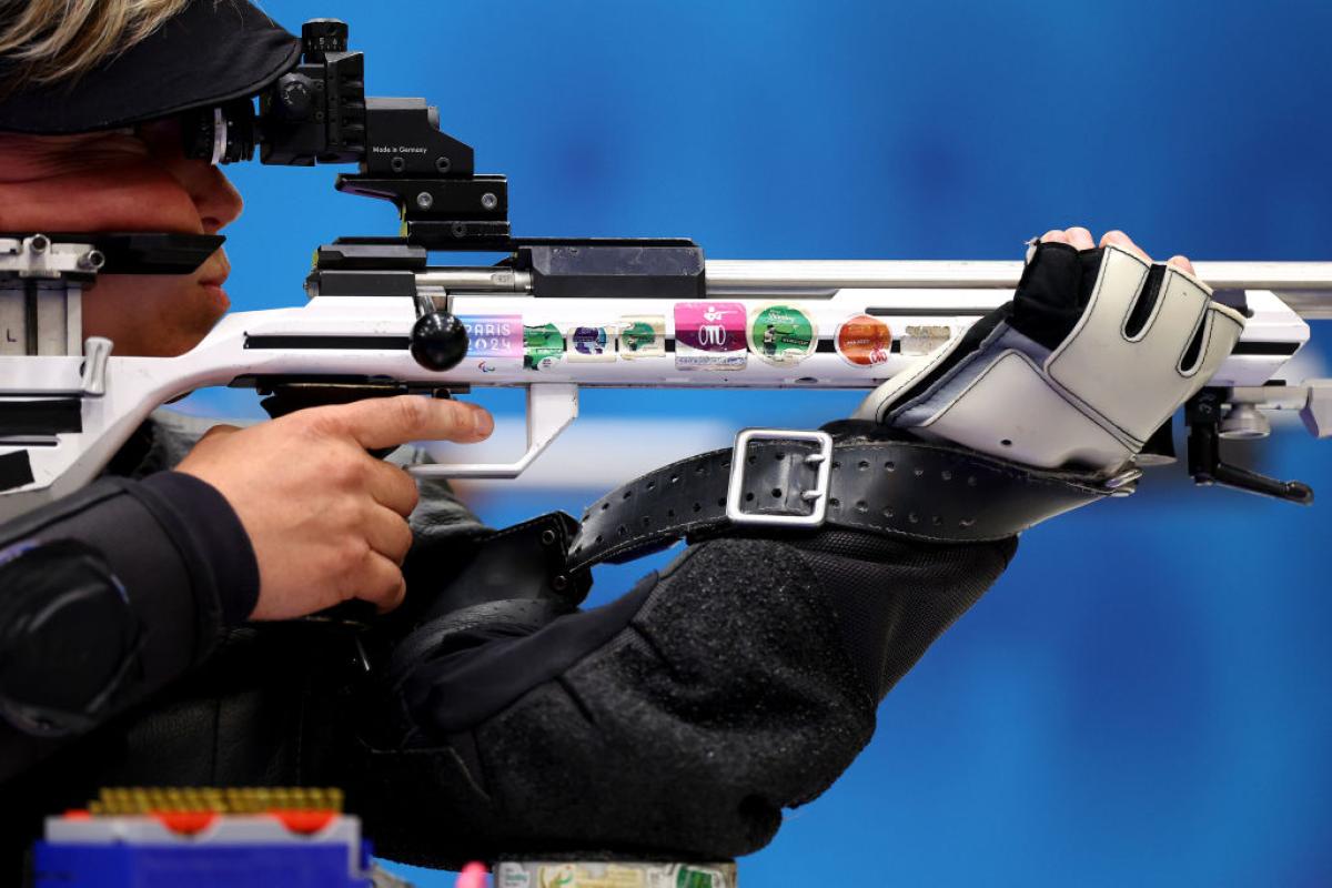A woman in a rifle shooting event