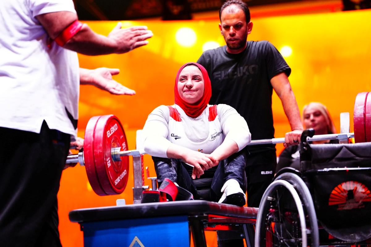An athlete reacts after her lift