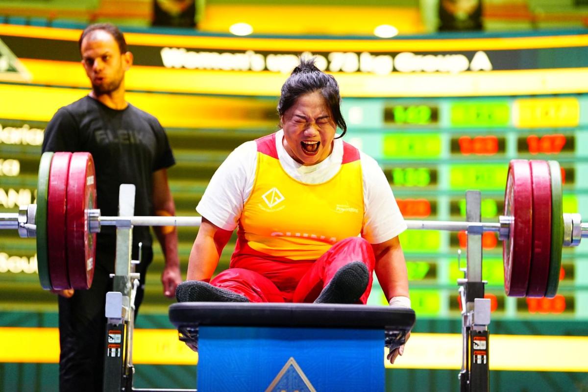 An athlete reacts on the bench