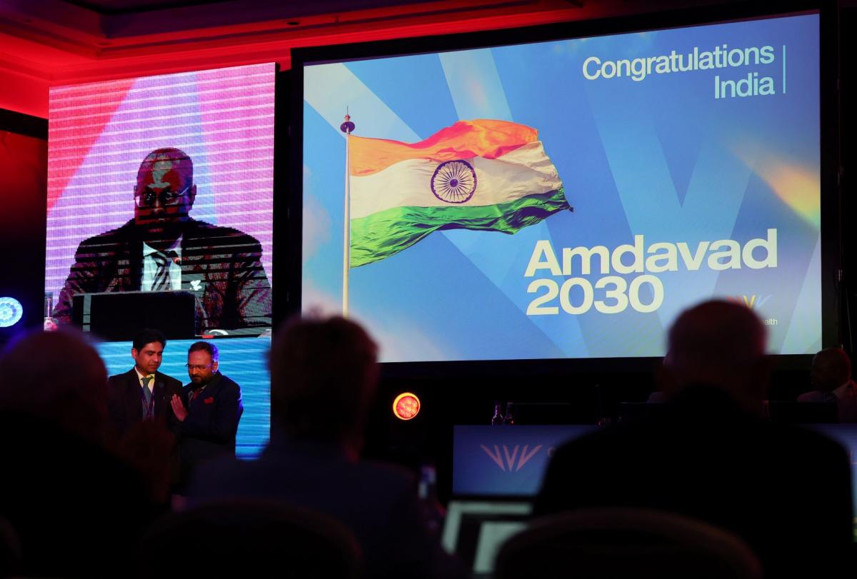 A photo of a screen that says Congratulations to India Amdavad 2030