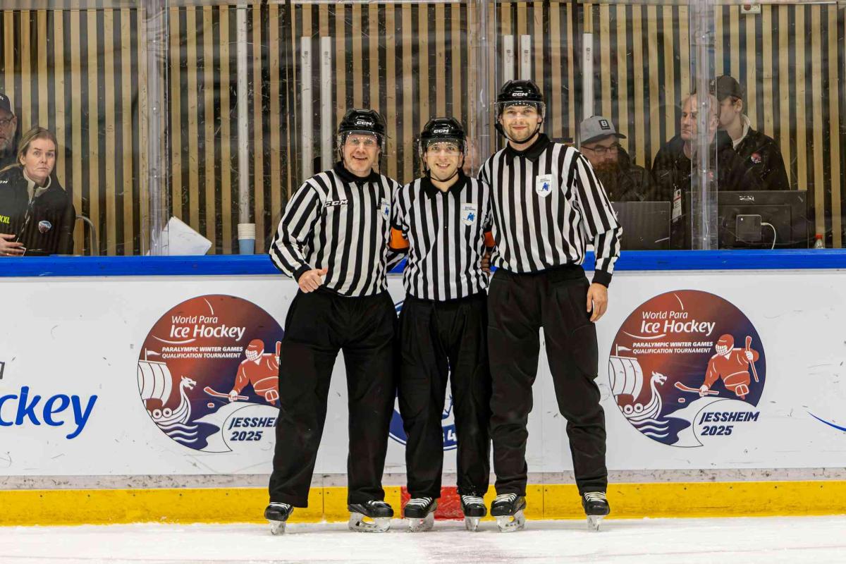 Officials pose after a match