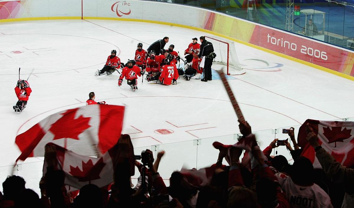 Canadian fans celebrating with the Para ice hockey team at Torino 2006