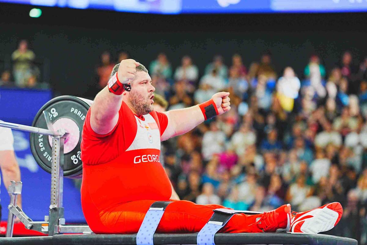 An athlete celebrates in joy