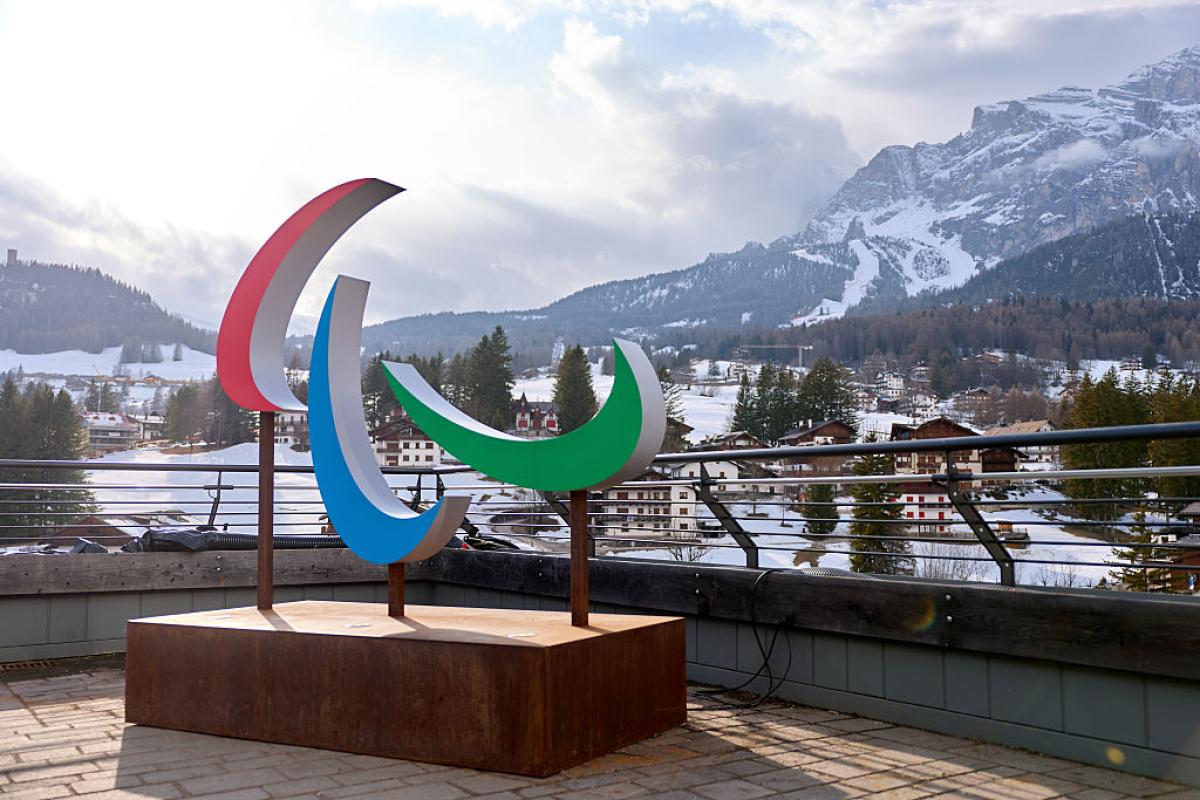 Agitos symbol in front of the dolomites