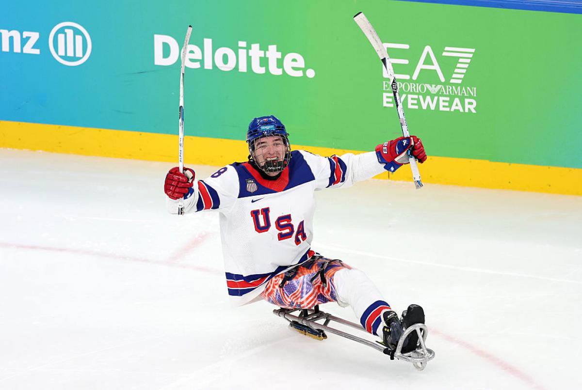A USA Para ice hockey player celebrating a goal